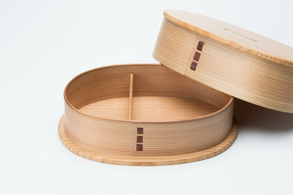 This is the the Magemono Bento Box with the lid opened. It is a light and durable lunch box made of wood.