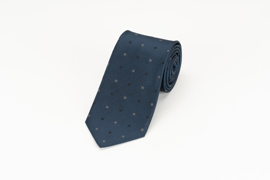 This is a navy necktie made of 100% silk.